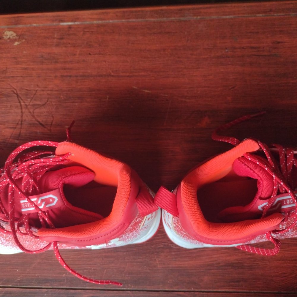 Locked down under armour football cleats.